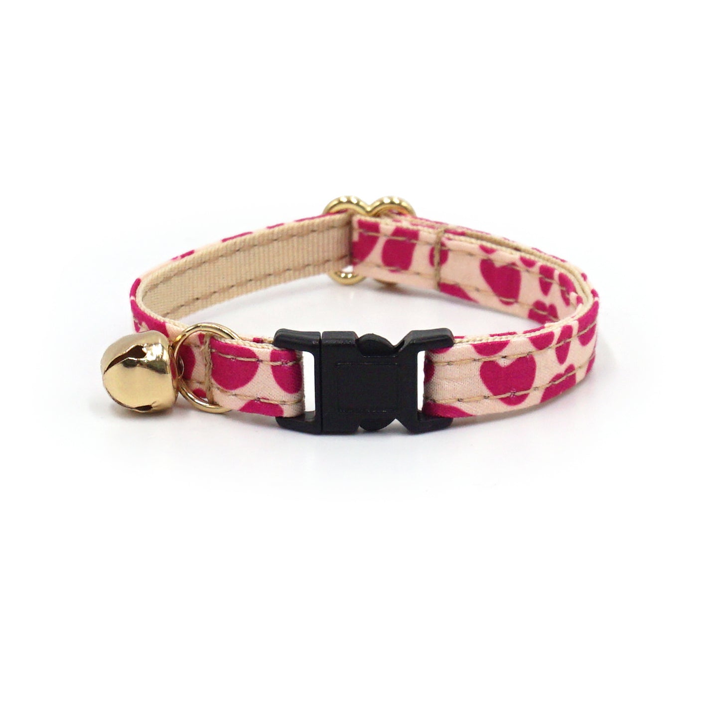 Collier chat antiétranglement en coton couleur léopard rose avec boucle noire et petit pendentif doré.
