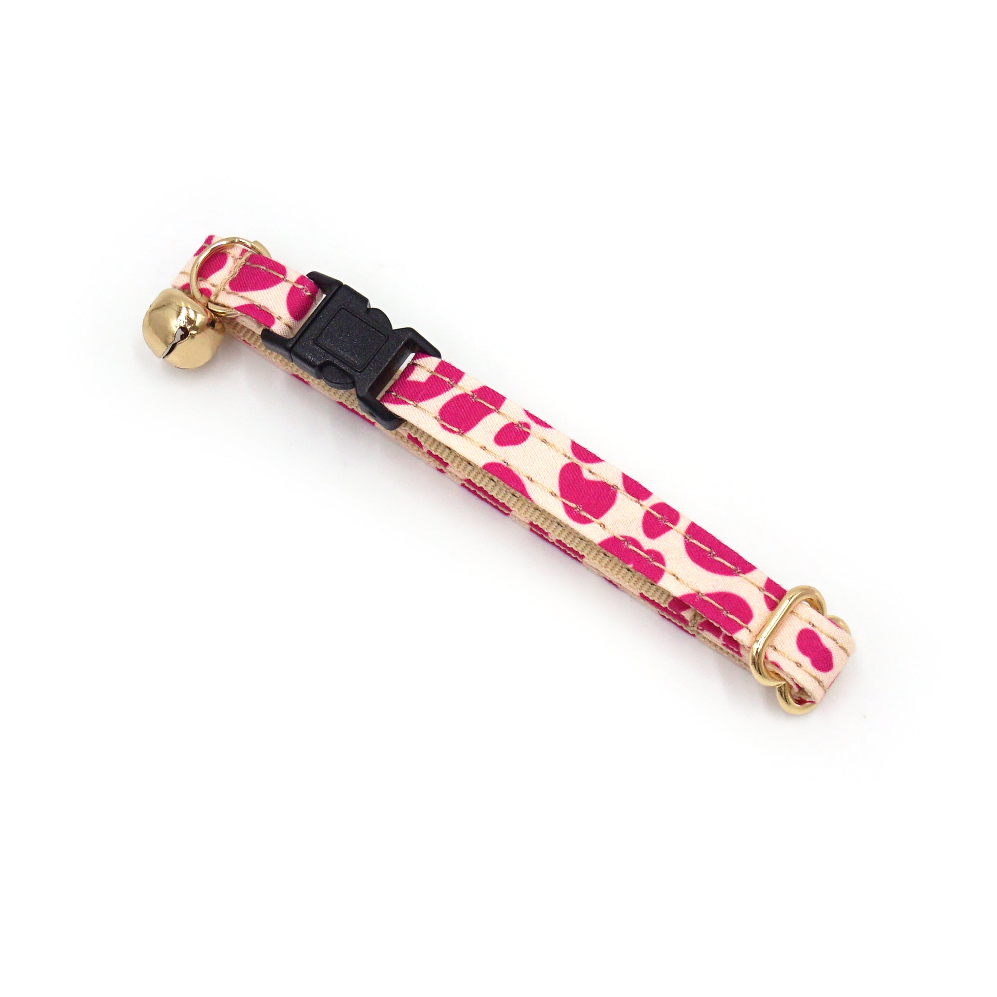 Collier chat anti-étranglement en coton rose léopard, petit motif et boucle noire avec cloche dorée.